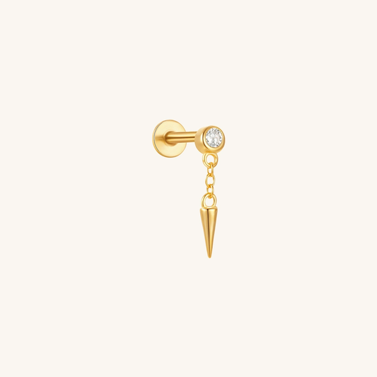 A minimalist close-up of a Gold Dangle Spike Bezel CZ Flatback Earring in 18k gold-plated sterling silver