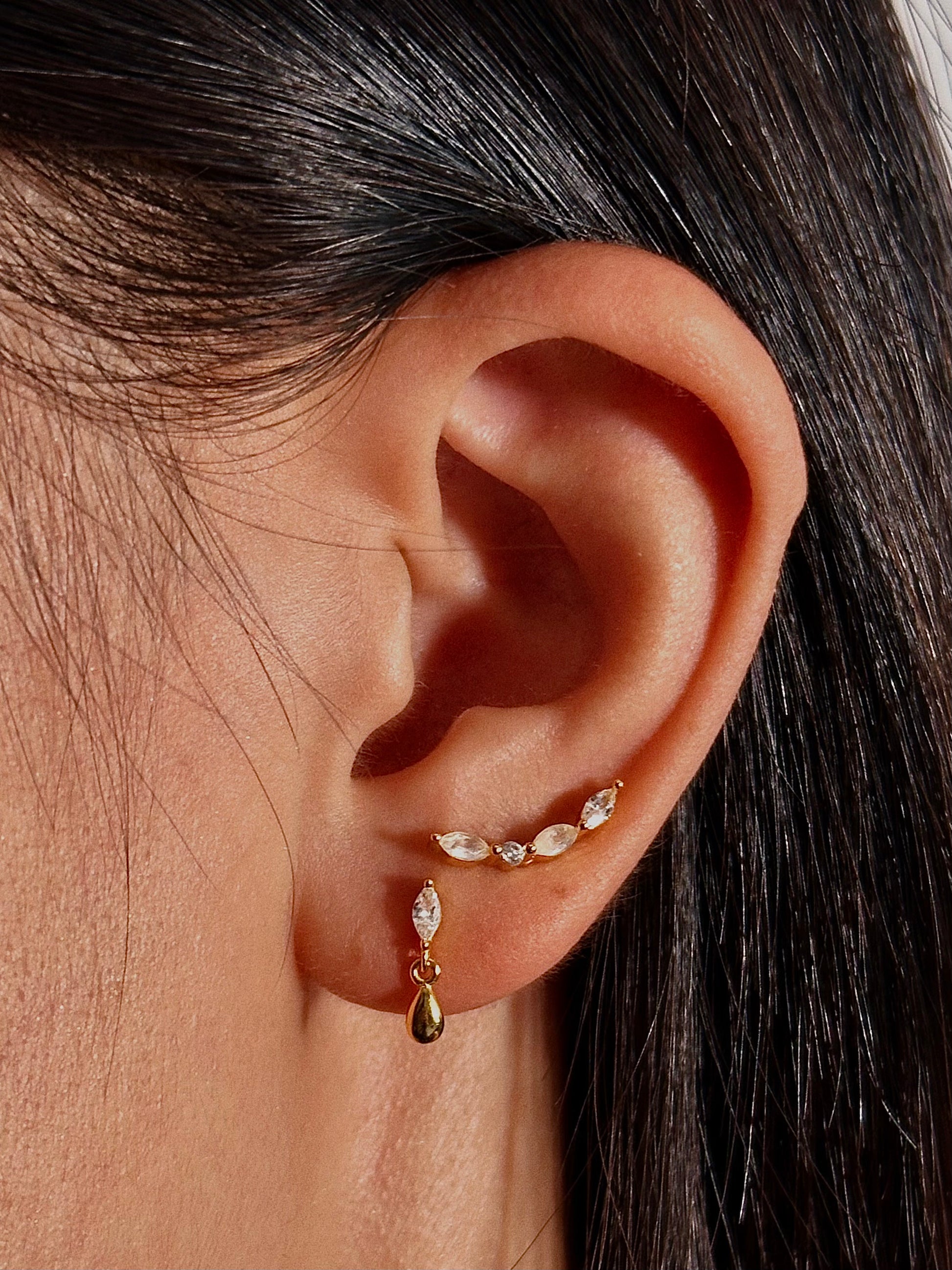 Close-up of marquise CZ teardrop dangle earring in 18K gold plated sterling silver