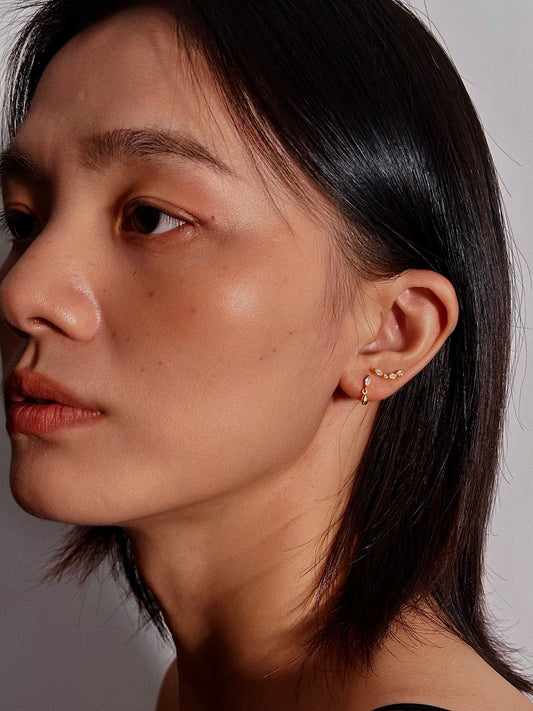 Marquise teardrop dangle flatback earring in 18K gold plated sterling silver, showing the 12mm length and 3mm marquise stone on a model's ear