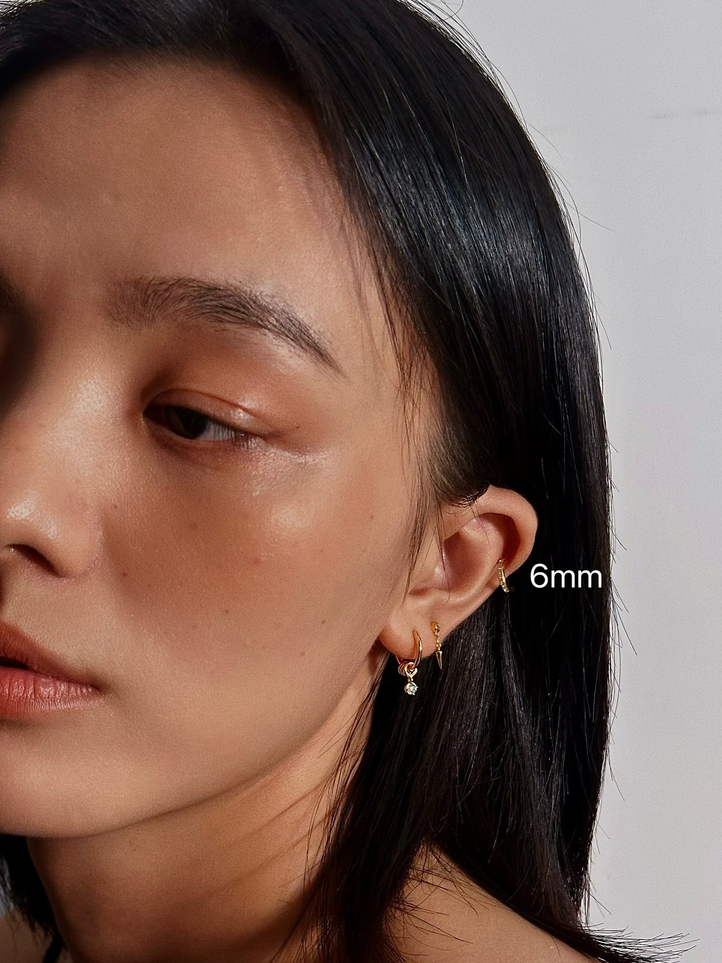 6mm CZ Pavé Huggie Flatback Earring with other minimalist gold jewelry for everyday wear.