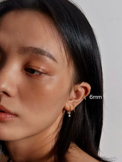 6mm CZ Pavé Huggie Flatback Earring with other minimalist gold jewelry for everyday wear.