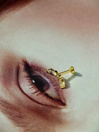 Flat lay of natural moonstone curve flatback earring in 18K gold plated sterling silver